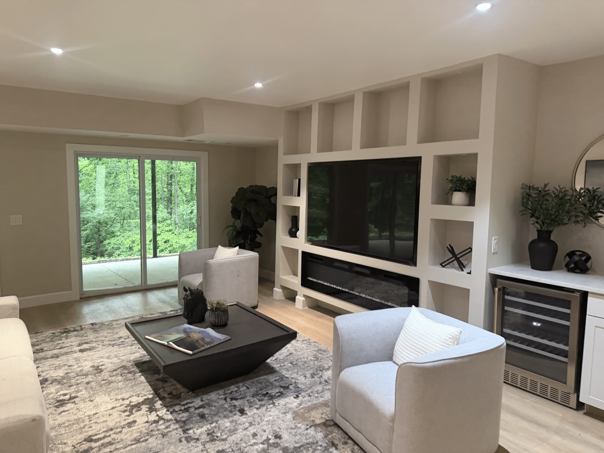 Family room with a built-in TV wall and fireplace after our visit