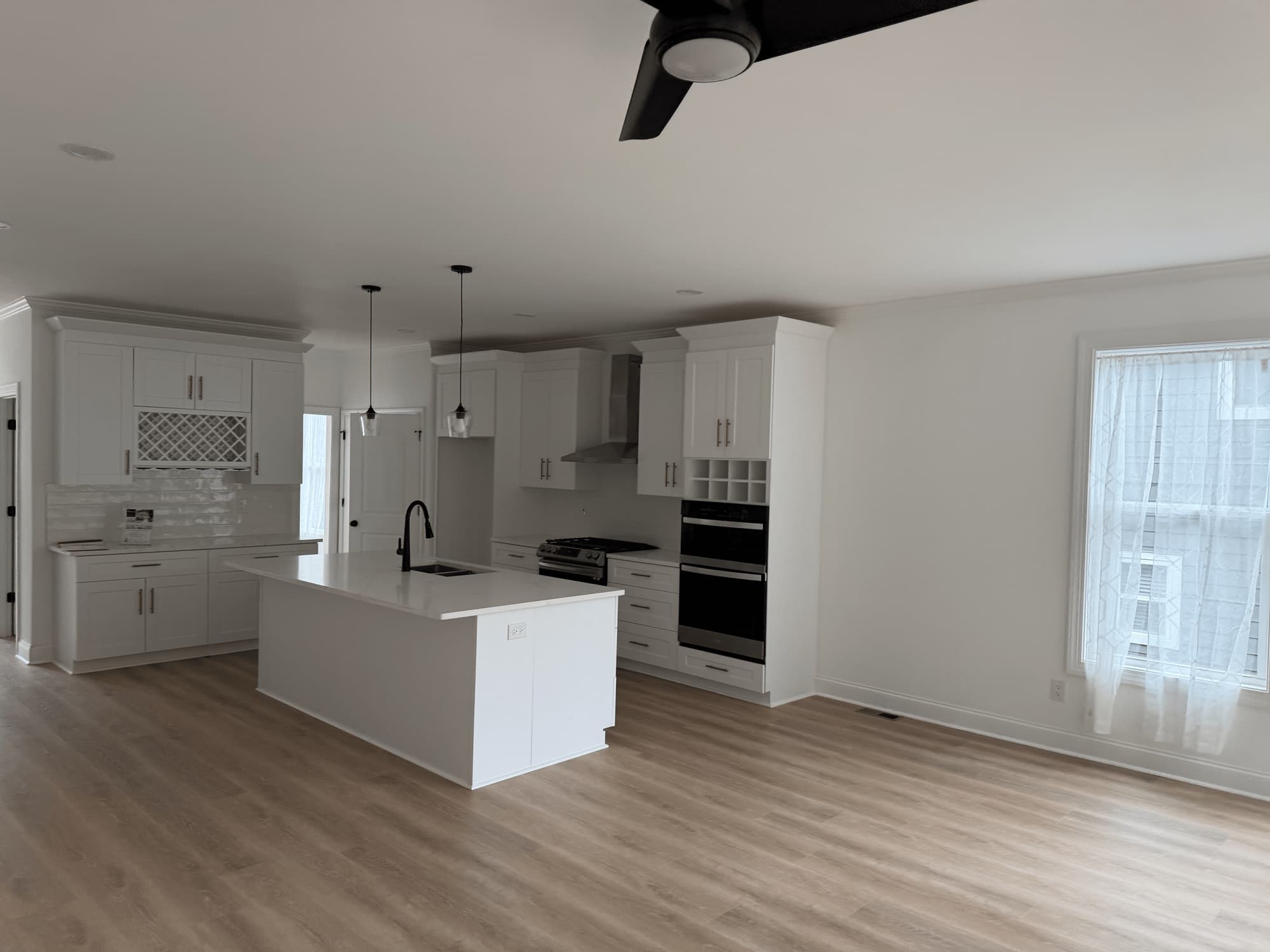 Open-plan kitchen and living area cleaned wall to wall
